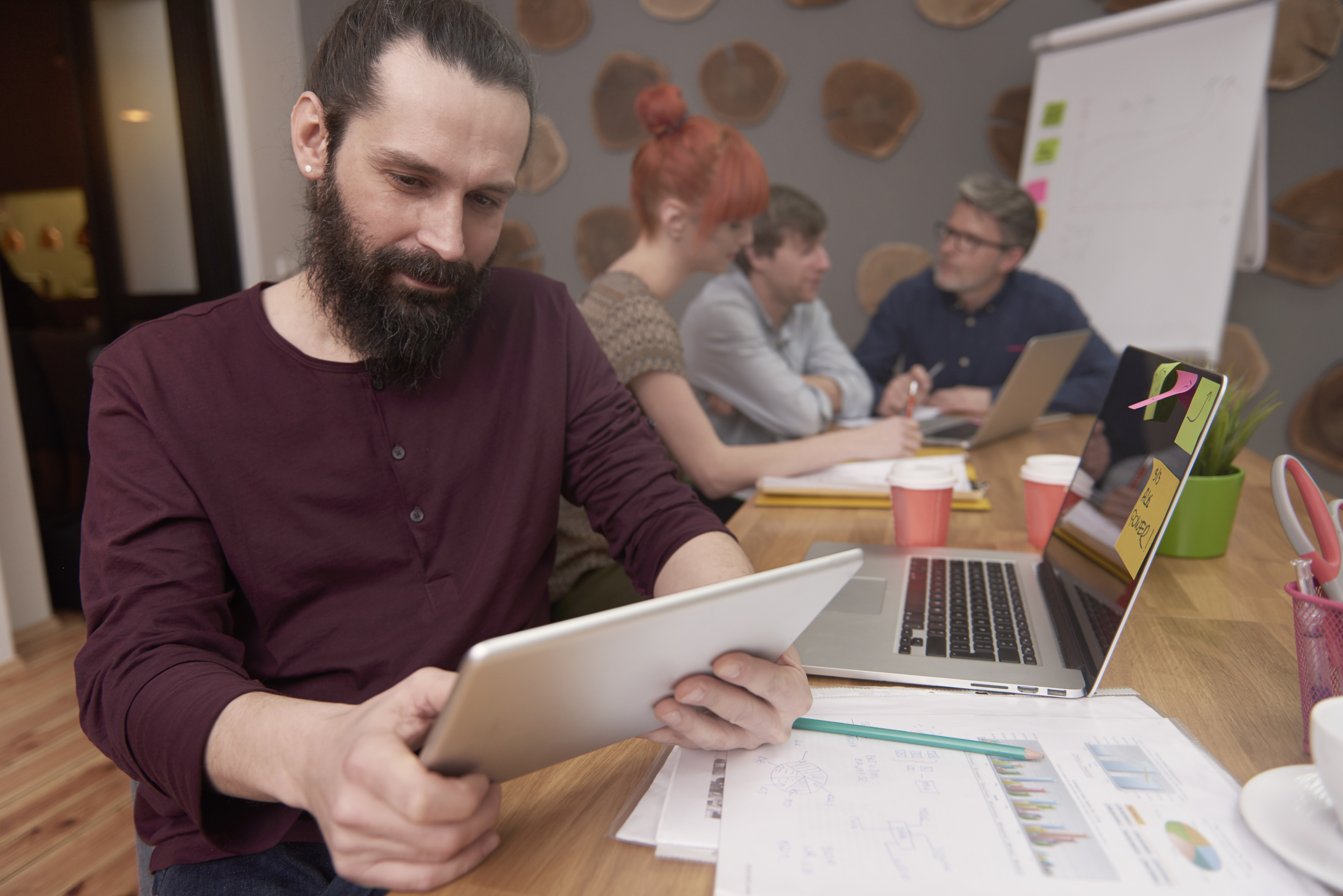fashionable man working at office