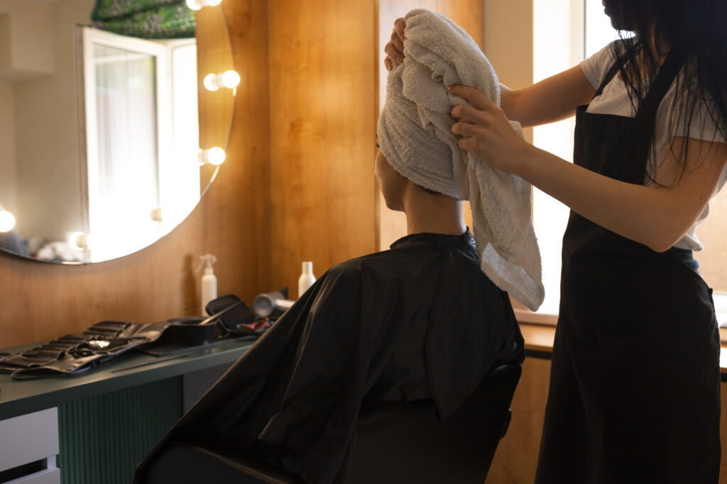 female client getting her hair dried hairdresser